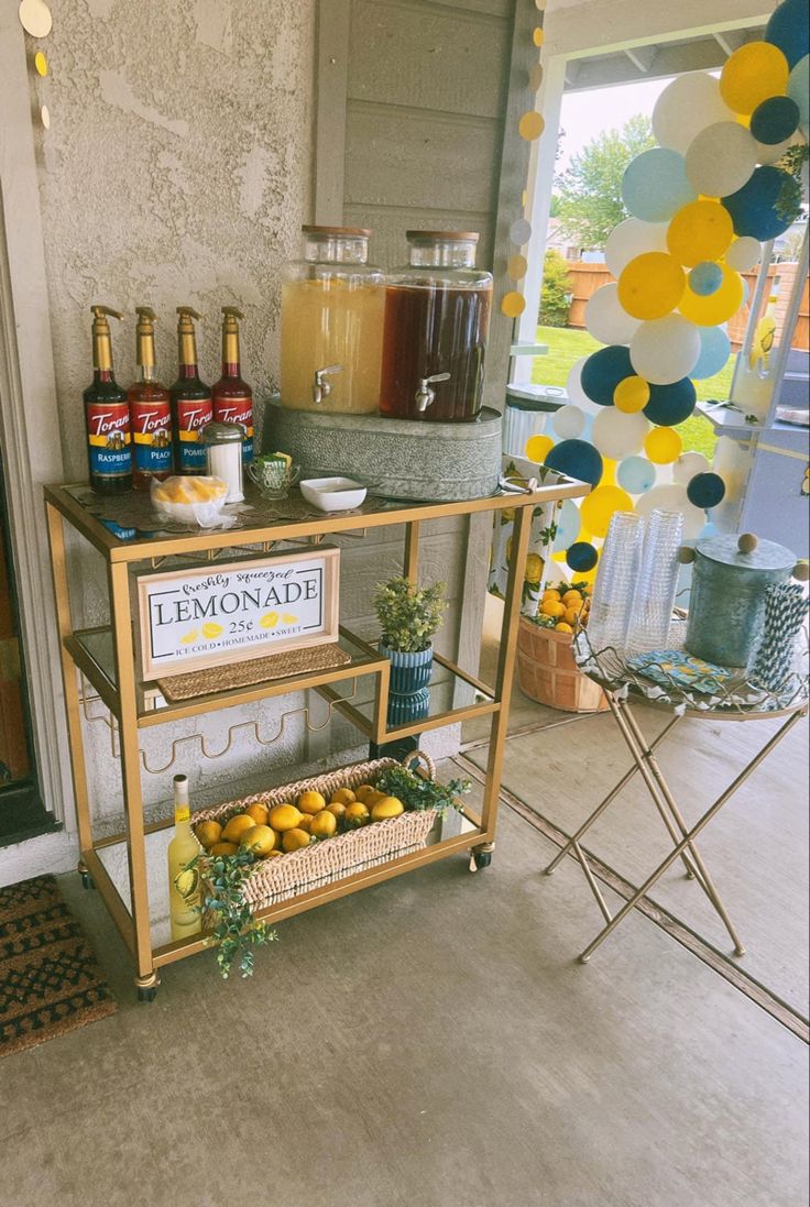 a lemonade stand is set up on the front porch