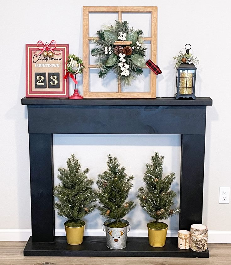 three potted plants sit on top of a mantle