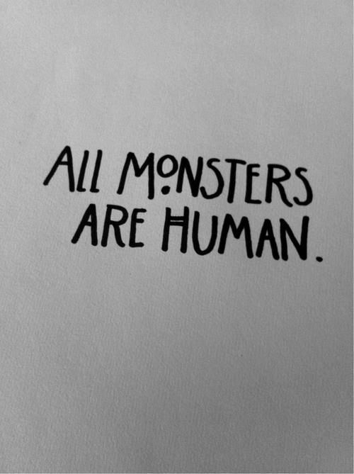 the words all monsters are human written in black ink on a white background with a red toothbrush