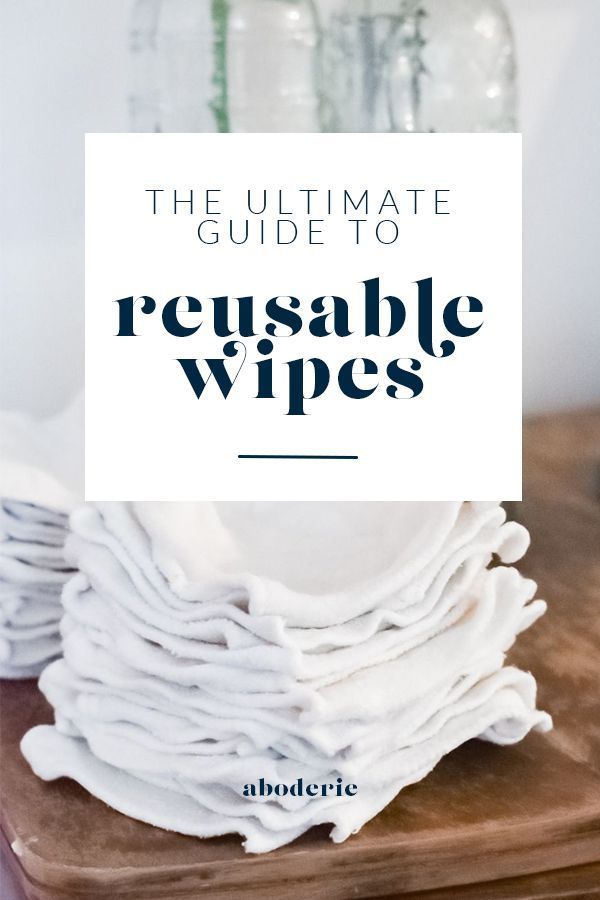 the ultimate guide to reusable wipes on a cutting board with bottles in the background