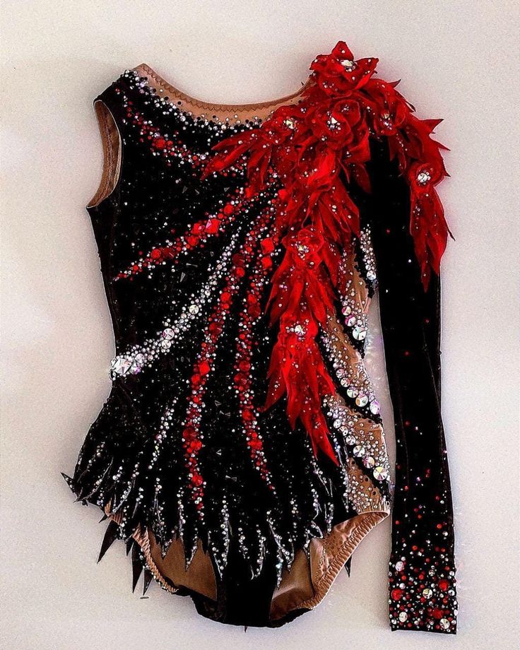 a black leotard with red and silver sequins