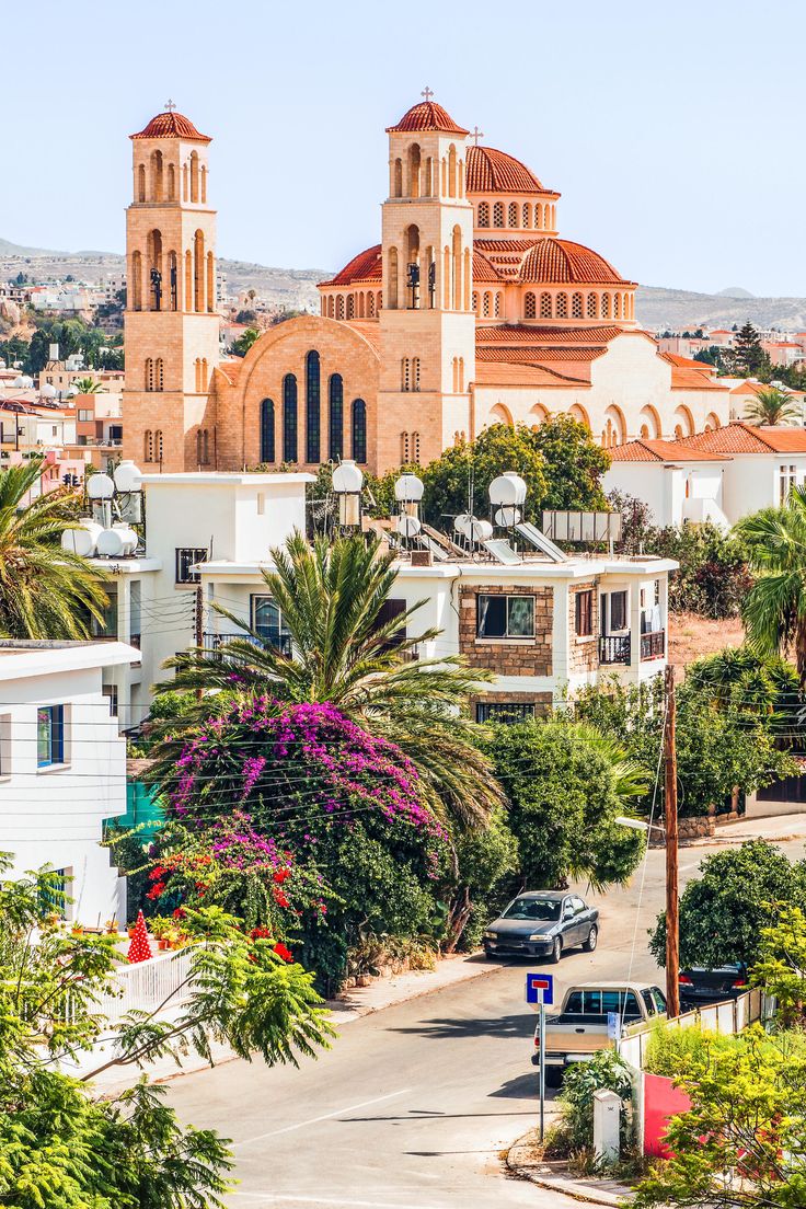 an aerial view of a city with buildings and palm trees