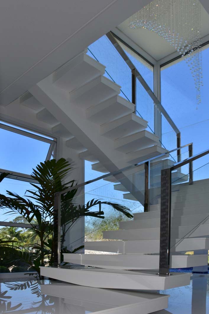 a modern staircase in the middle of a house