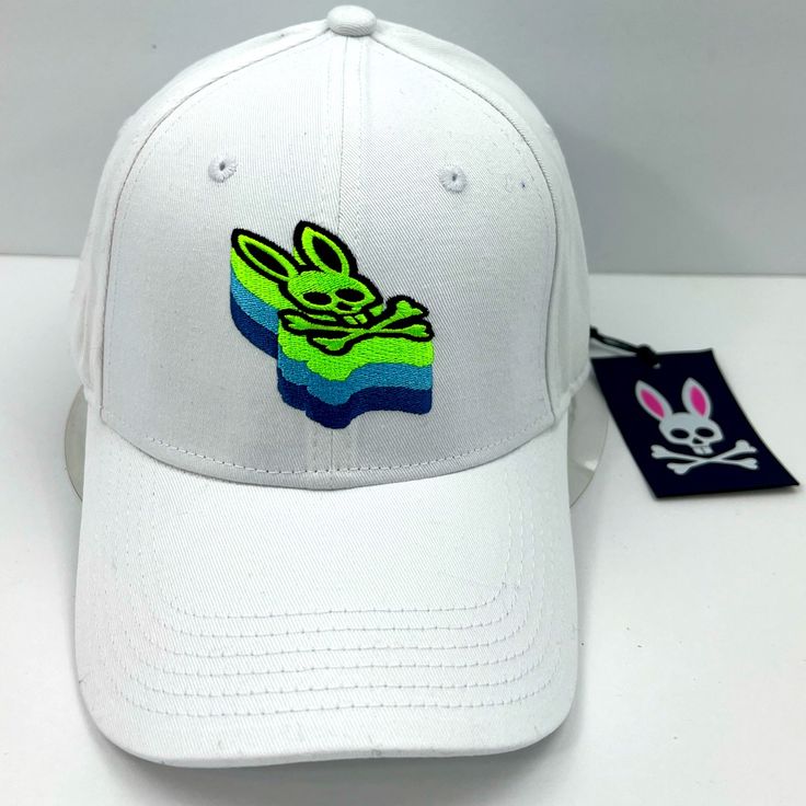 Psycho Bunny Baseball Cap,100% Cotton, Adjustable Strap, Embroidered Logo,Unisex . Brand New Never Used . Original Tags Attached . Authentic And Real Product . The Color White . The Bunny Logo Is Embroided In Green, Blue & Black . Very High-End, Prestigious, And Comfortable ******** Unisex******** Non Smoking House Ambassador Ii, For Over Two Years Same Day Shipping 5 Star Customer Ratings All Offers Are Welcomed Embroidered White Baseball Cap For Streetwear, White Embroidered Baseball Cap For Streetwear, White Embroidered Cotton Baseball Cap, White Hats For Spring Streetwear, Trendy White Baseball Cap With Embroidered Logo, White Snapback Baseball Cap For Spring, White Baseball Cap For Spring Streetwear, Trendy White Embroidered Hat, Casual White Baseball Cap With Embroidered Logo