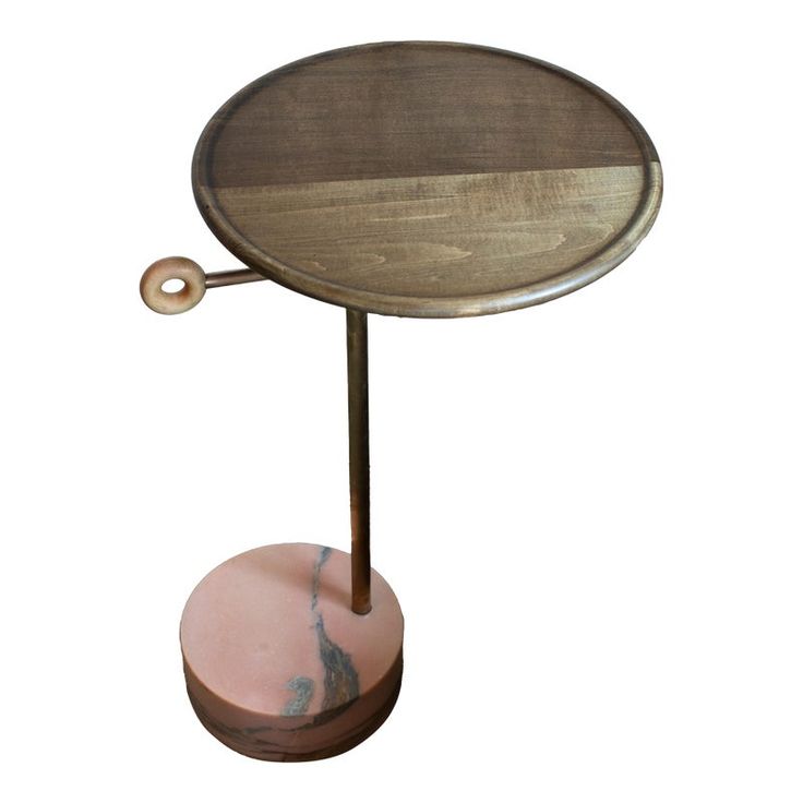 a wooden and metal table with a pink marble base on the top, against a white background