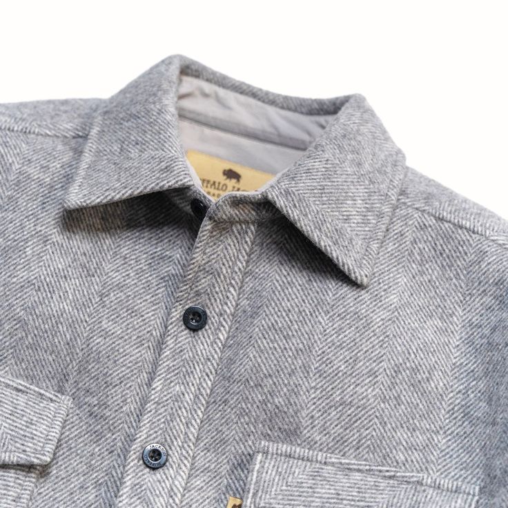 Few pieces of gear embody the rugged versatility of our Riverton Shirt Jac. Rooted in the working heritage of Buffalo Jackson, it’s a timeless classic designed for those who value both form and function. Crafted from a premium wool blend, it’s warm without the scratch, offering a softer feel against the skin while maintaining the durability you need in the great outdoors. Our fit is more modern, and less bulky for a trimmer presentation. The mid-weight fabric strikes the perfect balance—keeping Classic Short Sleeve Winter Shirt, Classic Long Sleeve Outdoor Shirt, Classic Cotton Shirt For Outdoor, Classic Winter Shirt For Everyday, Classic Winter Tops For Outdoor, Classic Short Sleeve Top For Outdoor, Classic Gray Shirt For Fall, Classic Gray Fall Shirt, Classic Winter Shirt With Welt Pockets