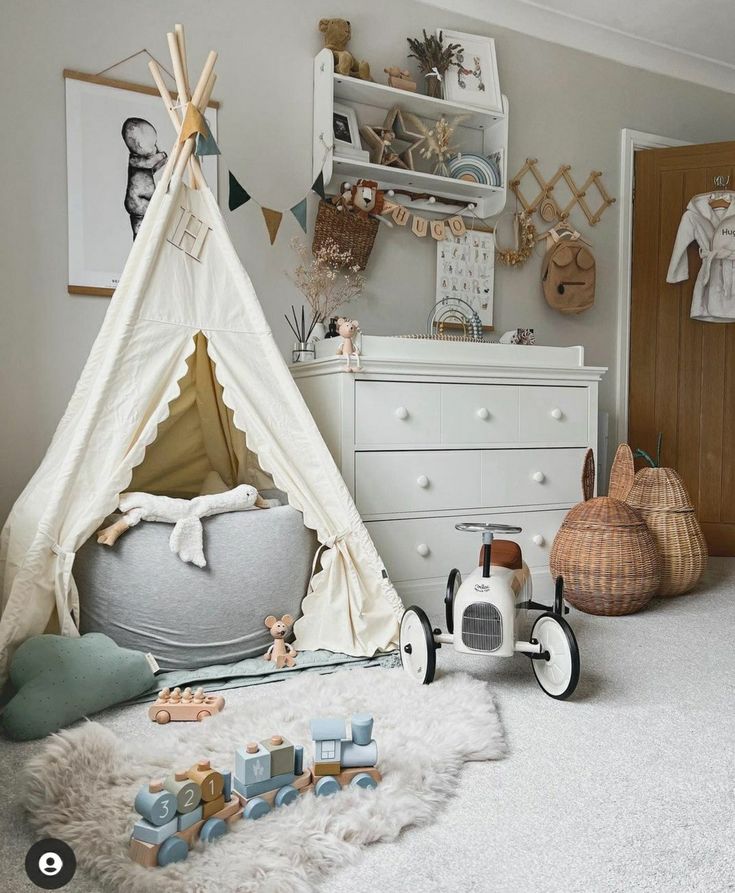 a child's bedroom with a teepee tent and toys