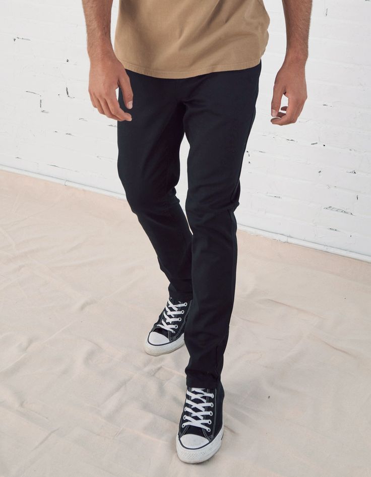 RSQ Slim Chinos. Formerly known as the "London Skinny Chino Pants". Skinny straight leg. Slant front pockets with welt back pockets. Zip fly. Button waist. 97% cotton/3% spandex. Machine wash. Imported.Model is 6'2.5" wearing a size 31x32.Approx outseam: 40.5" Approx leg opening: 14.5" Slim Fit Straight Leg Bottoms With Button Zip Fly, Casual Slim Fit Bottoms With Button Closure, Business Casual Bottoms With Button Zip Fly, Casual Business Bottoms With Button Zip Fly, Fitted Bottoms For Business Casual, Fitted Casual Pants With Button Closure, Casual Dress Pants With Button Closure For Business Casual, Fitted Casual Bottoms With Button Closure, Stretch Straight Leg Bottoms With Button Zip Fly