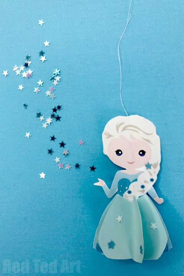 an ornament made to look like a frozen princess with stars hanging from it