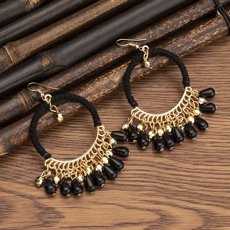 Bohemian Black Hoop Earrings With Dangling Beads, Black Bohemian Drop Earrings, Black Round Earrings With Dangling Beads, Bohemian Black Chandelier Drop Earrings, Bohemian Black Chandelier Earrings, Black Bohemian Chandelier Drop Earrings, Black Bohemian Jewelry With Tassels, Black Beaded Drop Tassel Earrings, Traditional Black Dangle Chandelier Earrings