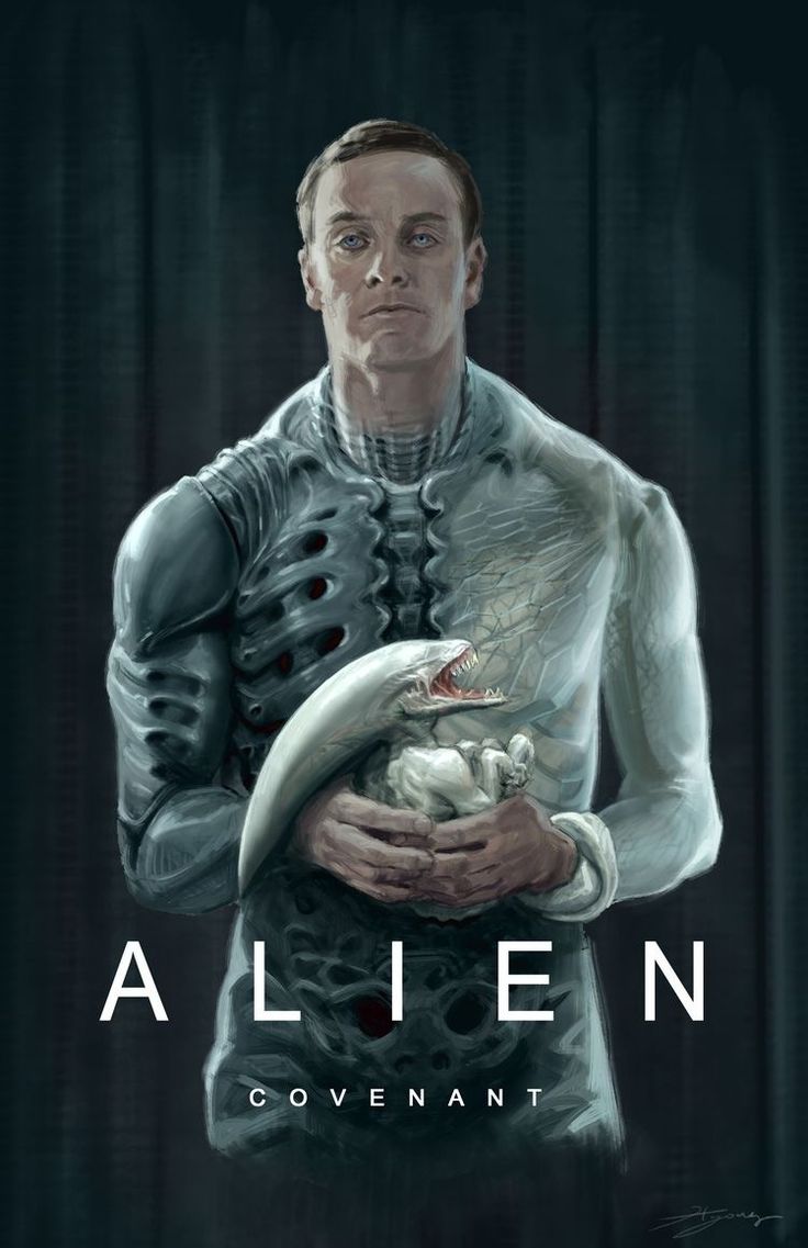 a man holding a baby in his arms with the words alien on it's chest