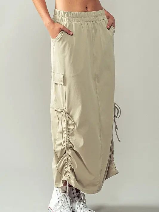 Drawstring cargo maxi skirt Fitted Maxi Skirt With Side Pockets For Spring, Relaxed Cargo Skirt With Pockets For Summer, Spring Long Cargo Skirt With Pockets, Summer Utility Cargo Skirt With Drawstring, Casual Summer Cargo Skirt With Drawstring, Casual Cargo Skirt With Drawstring For Summer, Casual Drawstring Cargo Skirt For Summer, Summer Wide Leg Cargo Skirt With Pockets, Casual Long Cargo Skirt For Summer