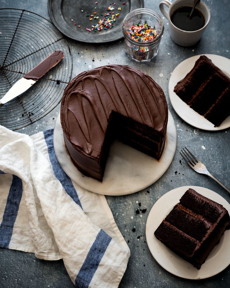 a chocolate cake sitting on top of a white plate