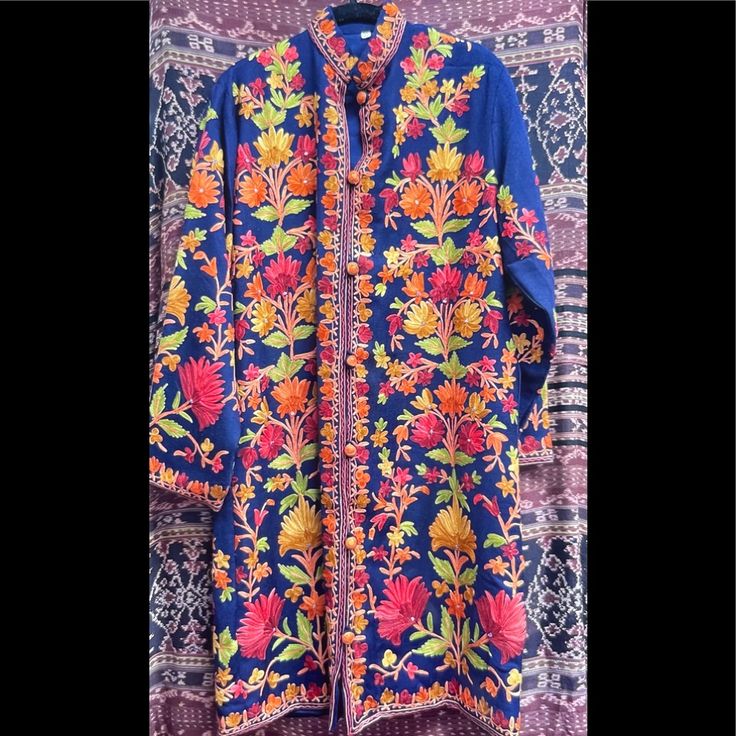 Hand Embroidered Long Kurta With Floral Embroidery For Fall, Long Outerwear With Floral Embroidery, Long Floral Embroidered Kurta For Fall, Traditional Blue Kurta For Fall, Long Embroidered Blue Outerwear, Red Floral Embroidered Outerwear, Long Blue Embroidered Outerwear, Embroidered Long Kurta For Fall, Long Embroidered Kurta For Fall