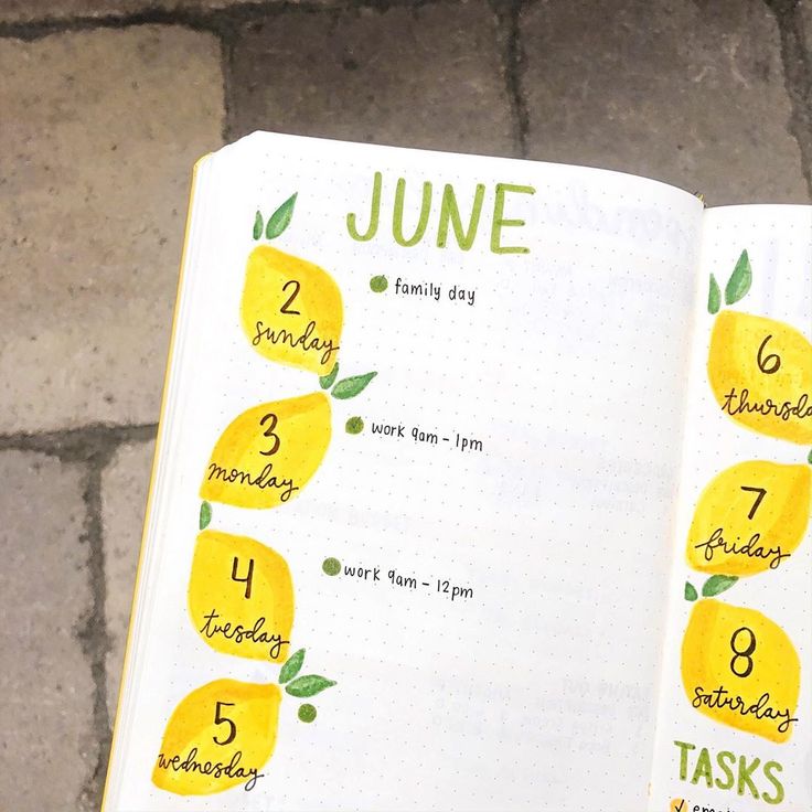 an open planner with lemons on it and the dates for each month in them