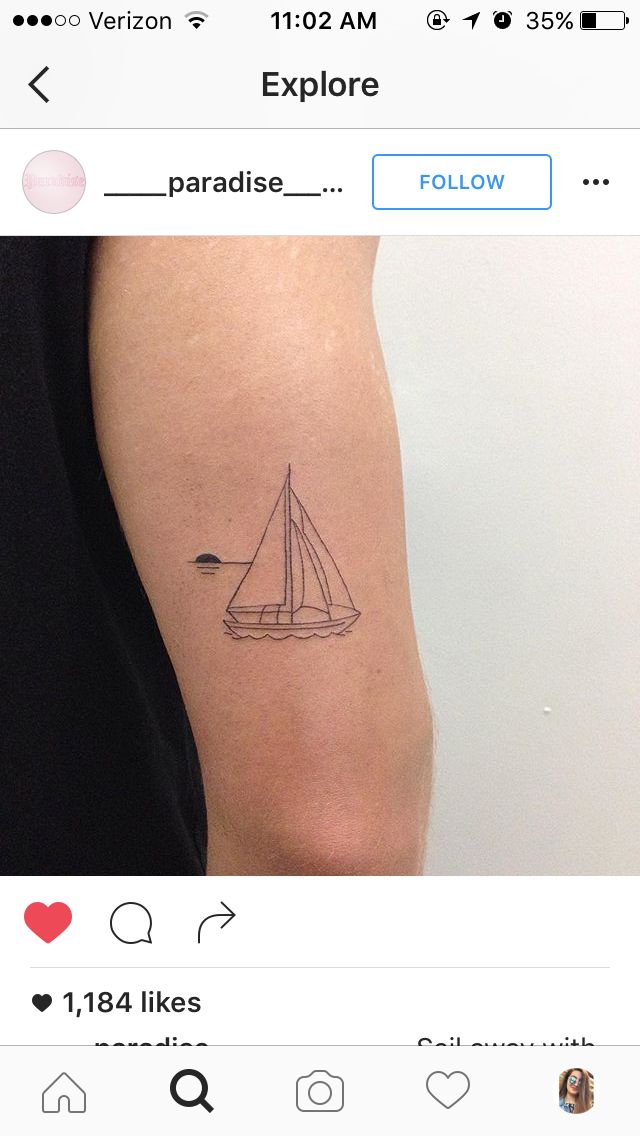 a small sailboat tattoo on the arm