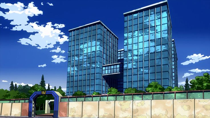 two tall buildings sitting next to each other in front of a blue sky with clouds