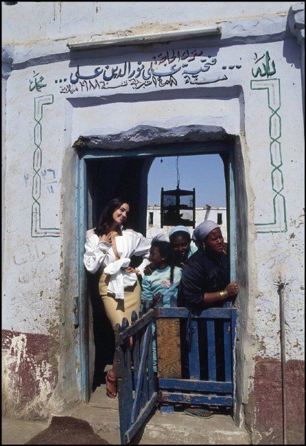 a group of people standing in front of a doorway