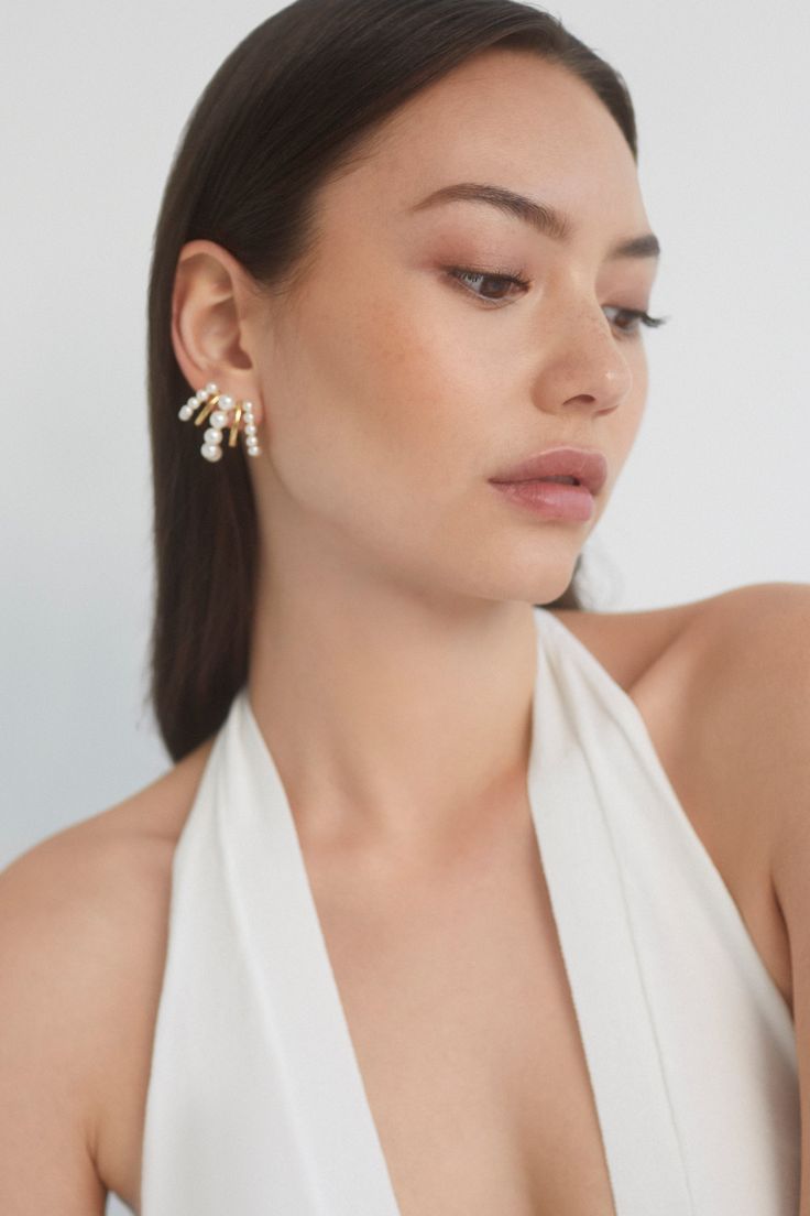 A classic style with a twist, these illusion earrings create the illusion of multiple hoops all in one for a dramatic and glamorous look. Perfect for adding a touch of elegance to your everyday look or making a statement on a special occasion. Chic Pearl Drop Clip-on Earrings For Party, Elegant Silver Wrap Earrings, Pearl White Pearl Earrings For Evening, Elegant Drop Earrings For Evening, Elegant Drop Wrap Earrings For Evening, Chic Pearl White Earrings For Formal Occasions, Elegant Single Ear Climber For Parties, Elegant Ear Cuff With Matching Earrings For Formal Occasions, Elegant Ear Cuff With Matching Earrings For Formal Events