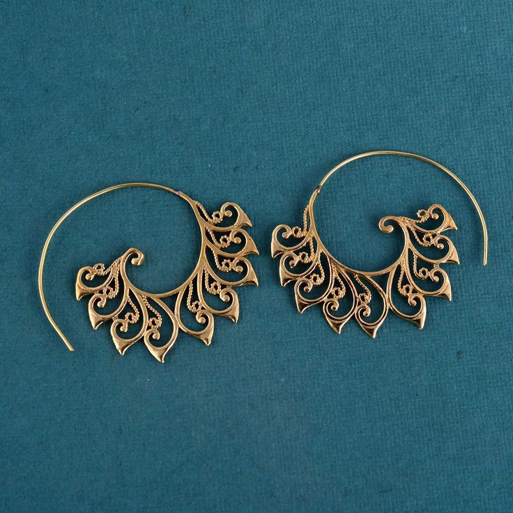 Women Brass Filigree earrings, dangle earring, statement earring, Hoop earring, gift for her, unique design, Ethnic earrings Material :- Brass Filigree gold hoop Earrings for woman, Lace hoop earrings ♥We Crafted These in 100% Solid brass These Simple earrings are perfect for any occasion. Then we lightly hammered and slightly polished to finish to keep a more matte finish~ Make a Statement with these minimal yet simple Unique rings. ♥Please make sure it include the correct address during before order. You can return item with in 10 days after successful delivery. We offer 100% Money back guarantee if you not satisfied with your purchase ♥Thank you for Visiting my shop! if you have any question please send me a message . I give you quickly reply so don't hesitate ask question, I am 24 hour Gold Bohemian Wrap Earrings, Gold Bohemian Wrap Earrings For Festivals, Bohemian Gold Wrap Earrings For Festival, Bohemian Teardrop Brass Hoop Earrings, Bohemian Wrap Earrings With Ear Wire, Bohemian Handmade Gold Wrap Earrings, Bohemian Gold Handmade Wrap Earrings, Handmade Vintage Spiral Jewelry, Unique Spiral Hoop Earrings Gift