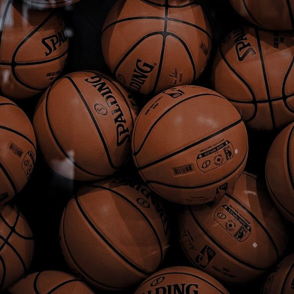 a pile of basketballs sitting on top of each other