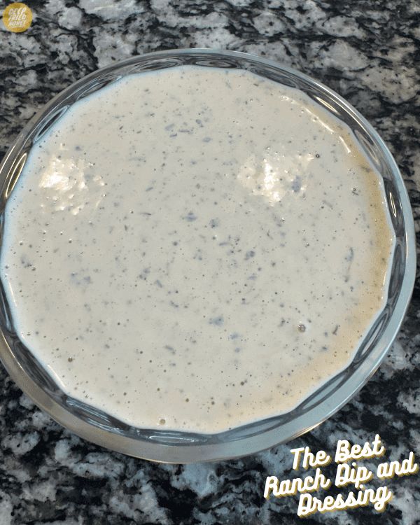 the best ranch dip and dressing recipe in a glass bowl on a granite countertop