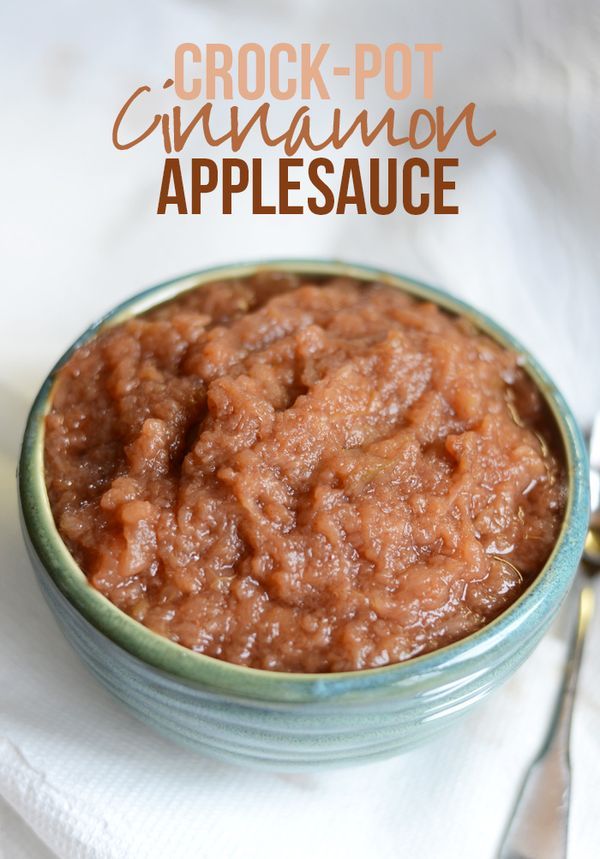 crock - pot cinnamon apple sauce in a bowl with spoon and napkin on the side