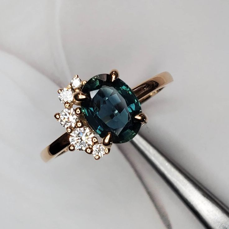 a ring with a blue diamond surrounded by white diamonds