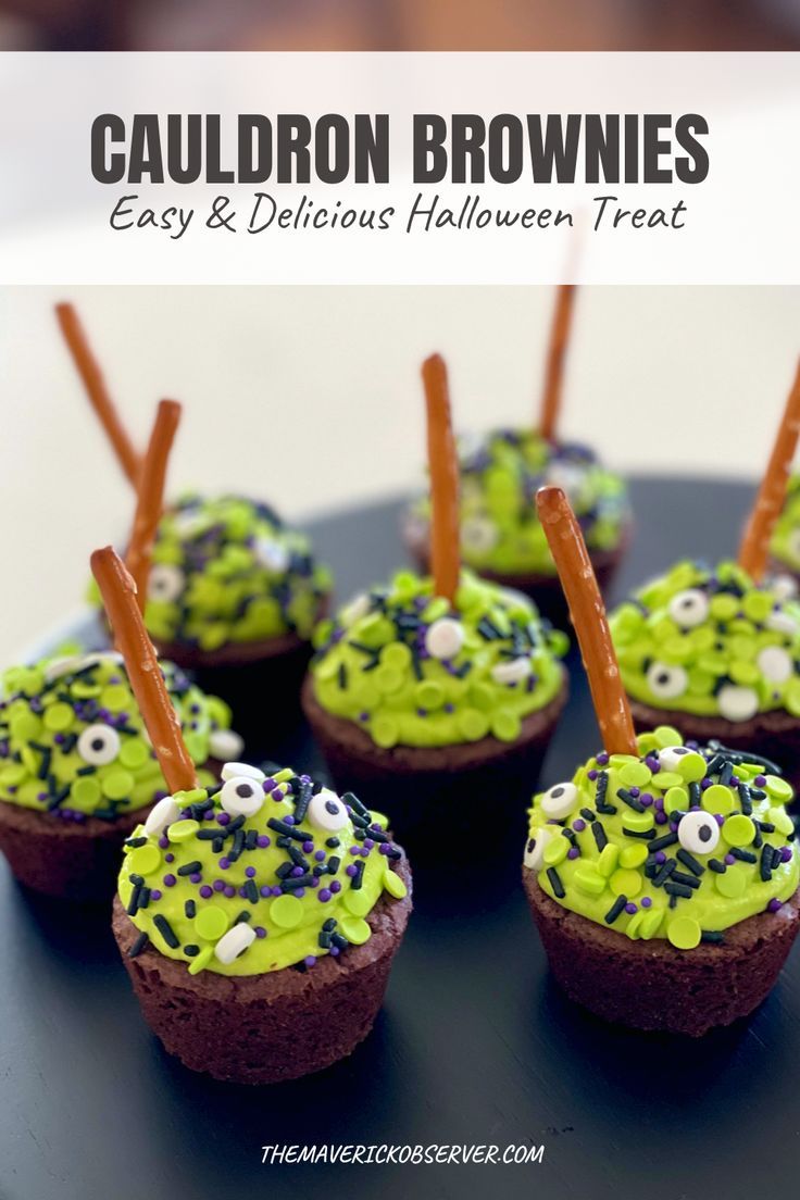 chocolate cupcakes decorated with green frosting and sprinkles on a black plate