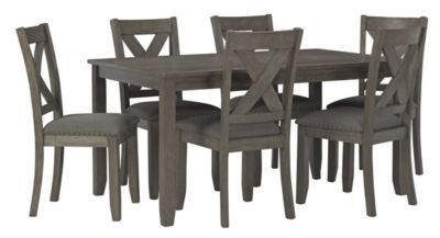 a dining room table and chairs set with grey upholstered wood finish on the legs