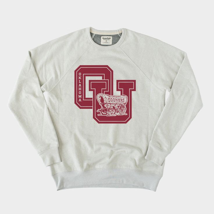 Featuring the classic Sooner Schooner logo with crimson collegiate block lettering, this retro crewneck sweatshirt is perfect for those chilly college football Saturday nights. Pick one up and help cheer OU onto another victory. Boomer Sooner!