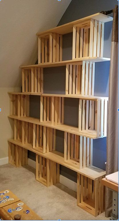 a book shelf made out of wooden pallets