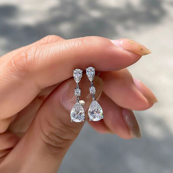 2Ct Pear Cut Lab Created Diamond Drop & Dangle Earrings 14K White Gold Plated  THIS RING IS READY TO MADE A ORDER  ✔ Metal Purity : 925 Sterling Silver ✔ Main Stone Shape : Pear Cut ✔ Main Stone : White ✔ Main Stone Color : Diamond ✔ Main Stone Creation : Simulated ✔ Main Stone CT Weight : 2.00 CT ✔ Ready to Ship in 5-7 Business Days ♥ Custom Birthstone Ring ♥  The most unique jewelry you can find, perfect gift for you and your loved one  ♥ BIRTHSTONE COLOR ♥ * Design can be personalized with your BIRTHSTONE COLORS: January - Garnet February - Amethyst March - Aquamarine April - Clear Crystal May - Emerald June - Light Amethyst July - Pink Ruby August - Dark Peridot September - Sapphire October - Light Tourmaline November - Yellow Topaz December - Blue Zircon O T H E R ∙ I N F O R M A T I Luxury Silver Diamond Engagement Earrings, Luxury Pear Shaped Sterling Silver Diamond Earrings, Luxury Sterling Silver Pear-shaped Jewelry, Luxury Sterling Silver Pear-shaped Bridal Earrings, Luxury White Gold Sterling Silver Teardrop Earrings, Luxury Diamond Cut Pear-shaped Bridal Earrings, Cheap Elegant Diamond White Earrings, Luxury Sparkling Diamond Engagement Earrings, Luxury Sterling Silver Evening Bridal Earrings