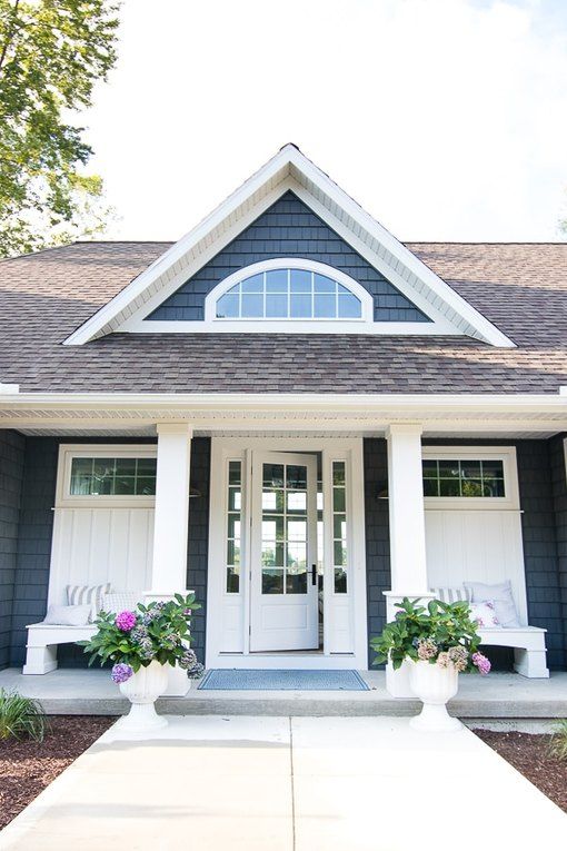 the instagram page shows an image of a gray house with white trim and windows