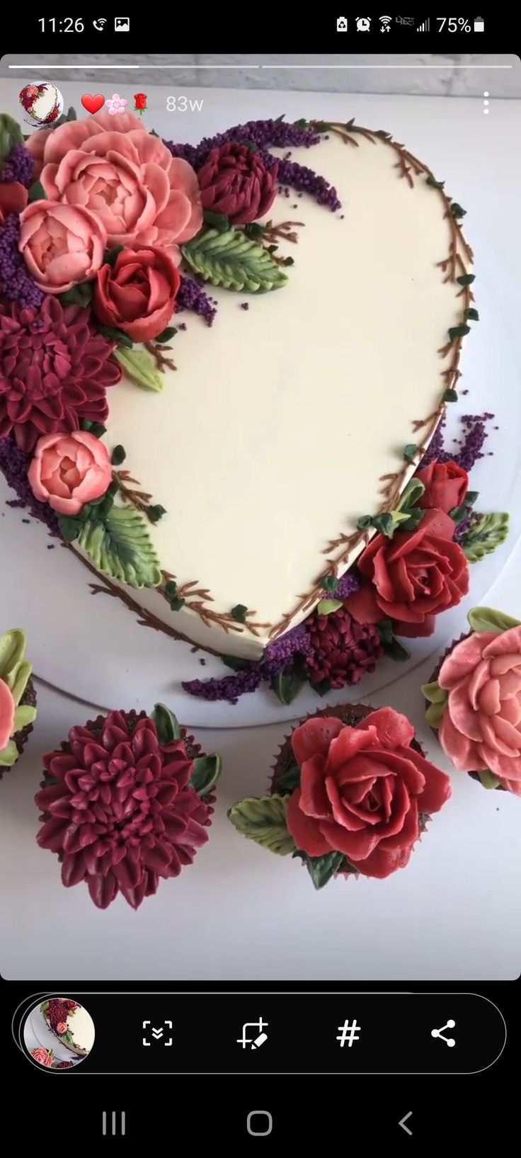 a heart shaped cake with flowers on it