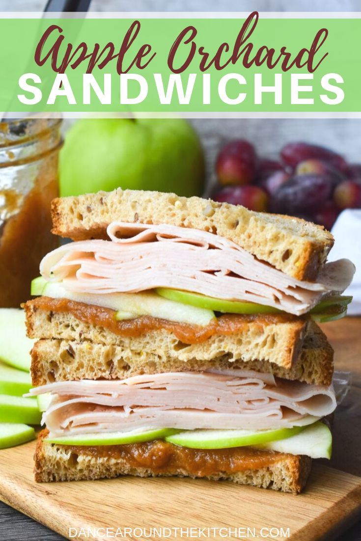 an apple orchard sandwich is stacked on top of each other with apples and cinnamon in the background