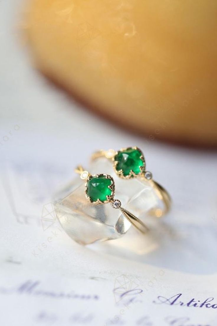 These vintage emerald ring is perfect for any occasion. #vintagejewelry #emeraldring #emeraldjewelry #vintagenegagementrings Green Crystal Open Ring In 14k Gold, Yellow Gold Emerald Cabochon Ring, Wedding Emerald Cabochon Ring In 14k Gold, Green Crystal Ring In 14k Gold, Fine Jewelry May Birthstone Cabochon Ring, Green 14k Gold Crystal Ring Fine Jewelry, Round Cabochon Emerald Promise Ring, Emerald Crystal Ring In Yellow Gold, Yellow Gold Emerald Crystal Ring