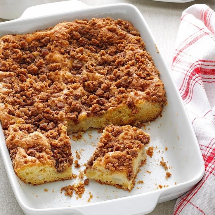 a casserole dish with pieces cut out and ready to be eaten on a table