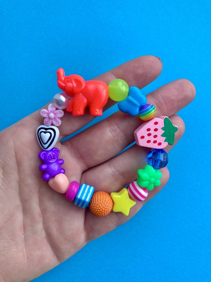 🌈X1 funky and completely unique elasticated bracelet, no two are the same!  Each will feature a bright animal bead and a wooden bead but other than that it's a surprise 🤫 one thing is for sure they are all equally fun!! 👀 if you have your eyes on a particular one feel free to request via a message and il let you know if it's available.  Handmade by me and ready to post 📮 Please see my other items 💜 ~N Playful Handmade Beaded Bracelets For Festival, Colorful Playful Beaded Bracelets For Festival, Fun Multicolor Stretch Bracelet For Birthday, Colorful Fun Stretch Bracelet For Friendship, Multicolor Fun Stretch Bracelet For Birthday, Fun Colorful Stretch Bracelet For Friendship, Playful Round Beads Bracelets For Festivals, Colorful Handmade Fun Stretch Bracelet, Handmade Fun Stretch Bracelet For Festival