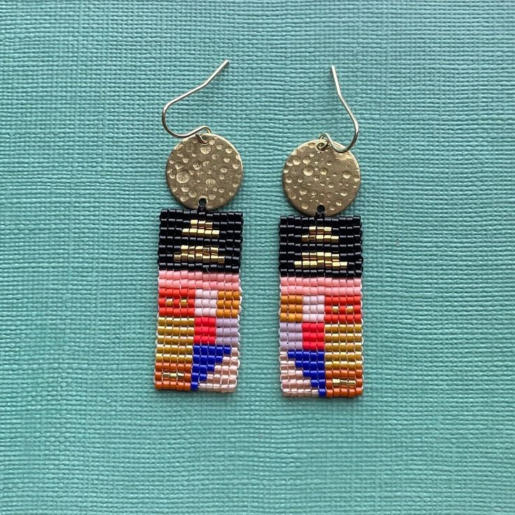 Quilt and textile inspired bars of color, made with glass Miyuki Delica beads, brass toppers, and a 14 K gold plated hypoallergenic ear wire Artisan Multicolor Beaded Earrings With Gold Beads, Multicolor Beaded Brass Earrings, Multicolor Beaded Brass Earrings As Gift, Multicolor Beaded Brass Earrings For Gift, Multicolor Brass Beaded Earrings As Gift, Multicolor Brass Beaded Earrings For Gift, Multicolor Brass Beaded Earrings For Festival, Brass Beaded Earrings With Tiny Beads As Gift, Multicolor Dangling Beaded Brass Earrings