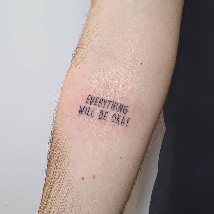 a man's arm with the words everything will be okay written in black ink