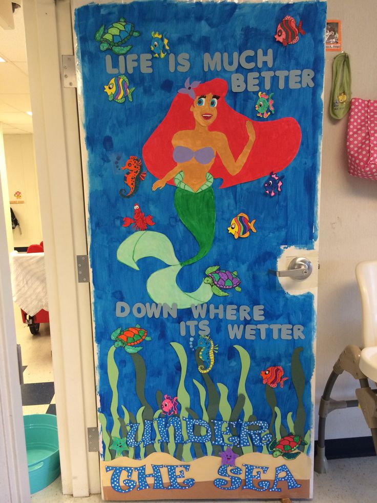 this door is decorated with an image of the little mermaid and under the sea theme