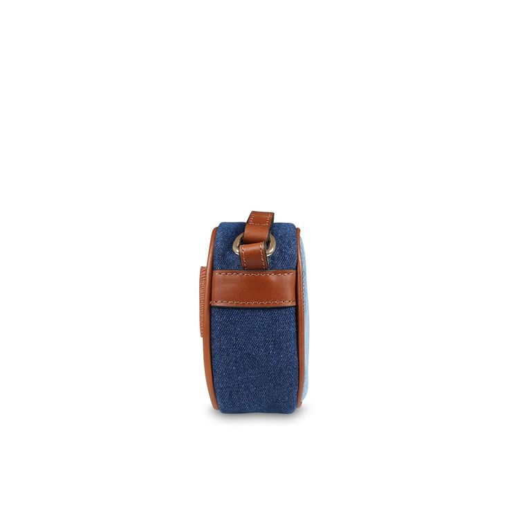 Color: Blue Denim blue bag from the French brand Chloé, made of soft organic cotton. This bag has a practical top zip closure and is equipped with an internal organic cotton twill lining. The brown adjustable shoulder strap adds a touch of practicality. It is embellished with a Chloé band inspired by the classic women's "Woody" and brown leather finishes for a refined and refined look. Dimensions (L x H x D): 17cm x12cm x5,5cm 100% Oragnic cotton. Blue Cotton Bag With Zipper Closure, Travel Shoulder Bag In Denim Blue With Leather Handles, Denim Blue Shoulder Bag With Leather Handles For Travel, Travel Shoulder Bag With Denim Blue And Leather Handles, Blue Shoulder Bag With Leather Trim For Daily Use, Blue Shoulder Bag With Leather Trim For Everyday, Everyday Blue Shoulder Bag With Leather Trim, Blue Cotton Shoulder Bag With Canvas Lining, Blue Canvas Shoulder Bag With Leather Trim