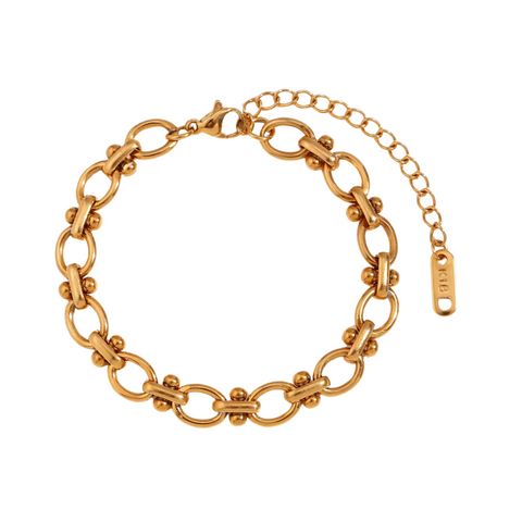 This stylish women's chain bracelet is an ideal option, as it can be worn solo to create... Gold Chain Metal Bracelets, Adjustable Elegant Chain Bracelet With Solid Links, Elegant Metal Chain Bracelet With Solid Links, Elegant Metal Charm Bracelet With Chain, Elegant Metal Chain Charm Bracelet, Elegant Metal Link Chain Bracelet, Dainty Metal Bracelets With Gold Chain, Gold Metal Chain Bracelet, Formal Gold Bracelet With Adjustable Chain