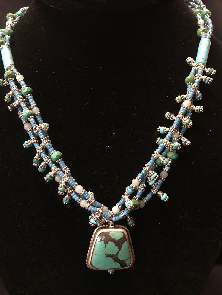 "Artist: Teresa Bradford Length: 18\" Turquoise Beads, Mali africa Trade seed beads circa 1940's Soft Blue Larimar, Silver Placers. In My Studio Creating with the color Blue Such a Tranquil Presence. ❤ Teresa Bradford-Cole Sacred Beaded, Modern Tribal Jewelry My work is emotional and passionate, weaving moments of the past, moments of the present, Visions of the future, cultivating & manifesting. Creating art to wear, to embrace the sacred shaman within. We are our own shaman. I am intense, Spiritual Beaded Turquoise Necklace For Festivals, Bohemian Hand-strung Turquoise Necklace For Festivals, Handmade Artisan Turquoise Necklace For Festivals, Artisan Turquoise Necklace For Festivals, Artisan Beaded Turquoise Necklace For Festivals, Traditional Hand-strung Turquoise Necklace For Festival, Artisan Hand-strung Turquoise Necklace For Festivals, Artisan Turquoise Necklace With Large Beads For Festival, Artisan Beaded Turquoise Necklace