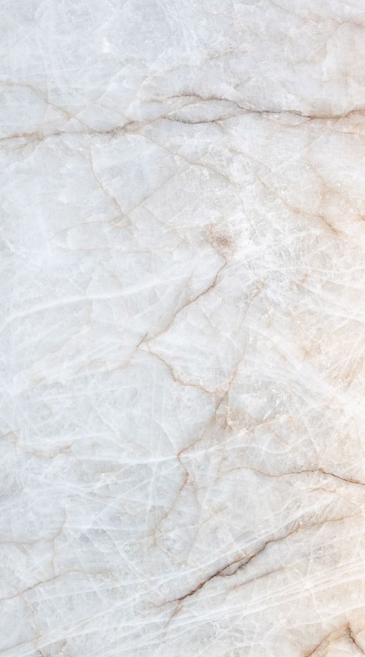 a white marble textured background with some light brown highlights on it's edges