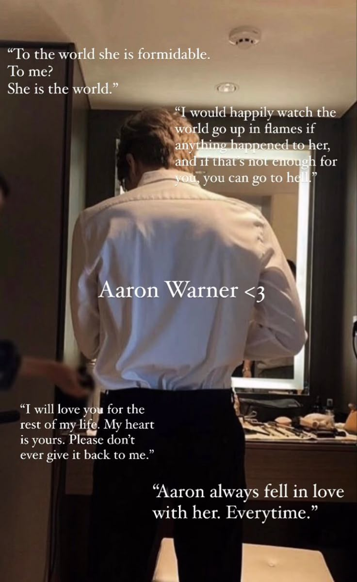 a man standing in front of a mirror with the words aaron warnner on it