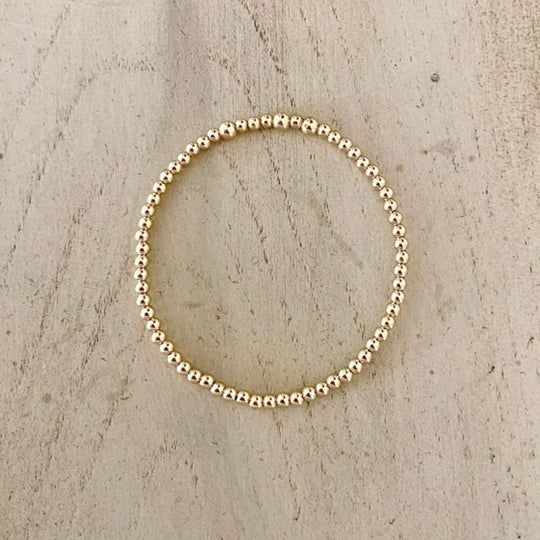 Your new favorite everyday staple! Our Bracelets are strung on elastic cord adding stretch for easily rolling on and off your wrist. Fits most wrist sizes and stretches over time a bit.     CZ round 5x5mm        CZ triangle 8x10mm      Gold Beads 14K gold filled  3mm 14K Beads 5mm with 18K gp cz bar Gold Bead Bracelets, Charm Rings, Pearl Ring, Gold Beads, Stretch Bracelets, Shop Necklaces, Stretching, Chemicals, Necklaces Bracelets