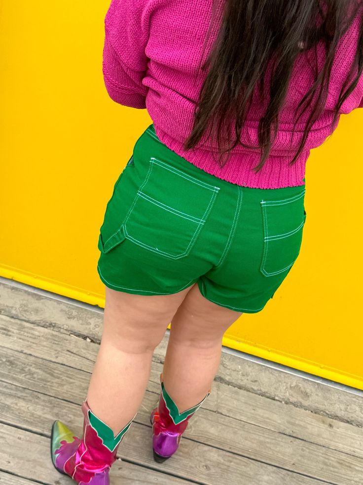 Be HAPPIER THEN EVER in our new green cargo shorts! With the stand-out stitching, high-waisted fit, and green color that is perfect for transitioning to fall, it will be impossible to feel sad in these shorts! Fabric is a sturdy denim that still has some stretch for extra comfort. We paired ours with the Sparks Fly top in orange and the Party tulle top. Perfect green color that transitions well with your fall fits! They have pockets! Sturdy denim but with some stretch High-waisted, flattering fi Green Cotton Bottoms With Built-in Shorts, Green Bottoms With Built-in Shorts For Spring, Trendy Green Shorts, Trendy Green Relaxed Fit Shorts, Green High-waisted Cotton Jean Shorts, Green High-waisted Jean Shorts For Spring, Green High-waisted Cotton Shorts, Spring Green High-waisted Jean Shorts, Trendy Green Cargo Bottoms