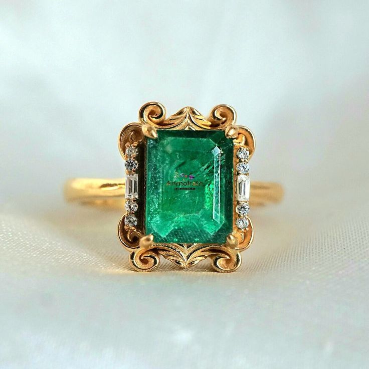 Emerald Ring Vintage, Real Emerald Ring & Diamond For Women, 14k Emerald Solitaire Wedding Ring, 3Ct Octagon Emerald Cut Stacking Ring Gift This ring features a stunning 3 Carat Natural Dark Emerald from Zambia framed by two baguette diamond moissanite and round diamond moissanite. This ring looks more beautiful in real with all vintage vibe. Available in 14K solid yellow gold & 18k Gold plated over silver. This ring acts as a perfect birthstone stacking ring, or a beautiful  & unique gift for w Luxury Emerald Ring With Baguette Cut And Accent Stones, Luxury Diamond Ring With Emerald Accent Stones, Luxury Octagon Diamond Ring With Accent Stones, Luxury Emerald Rings With Diamond Cut, Luxury Emerald Rings With Accent Stones, Emerald Ring With Baguette Cut For Formal Events, Emerald Jewelry With Brilliant Cut For Proposal, Luxury Emerald Cut Gemstone Rings, Luxury Octagon Emerald Ring With Accent Stones